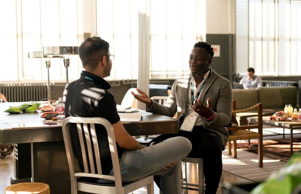 Photo of Men Having Conversation