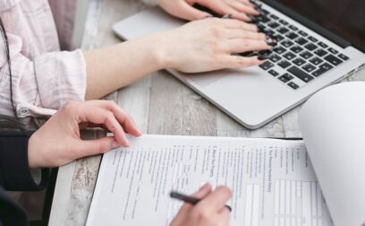 A Person Typing on Laptop