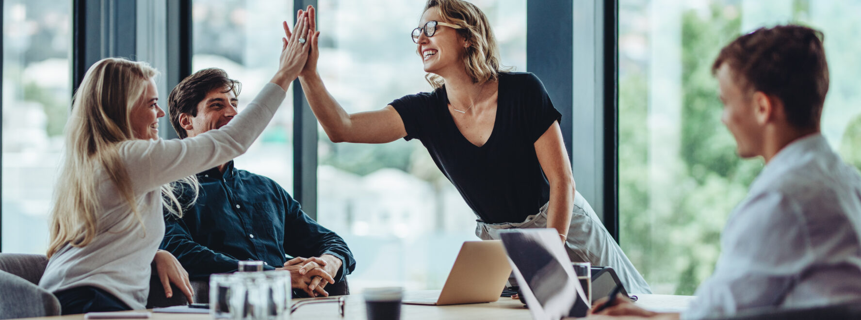 management celebrating with a high five